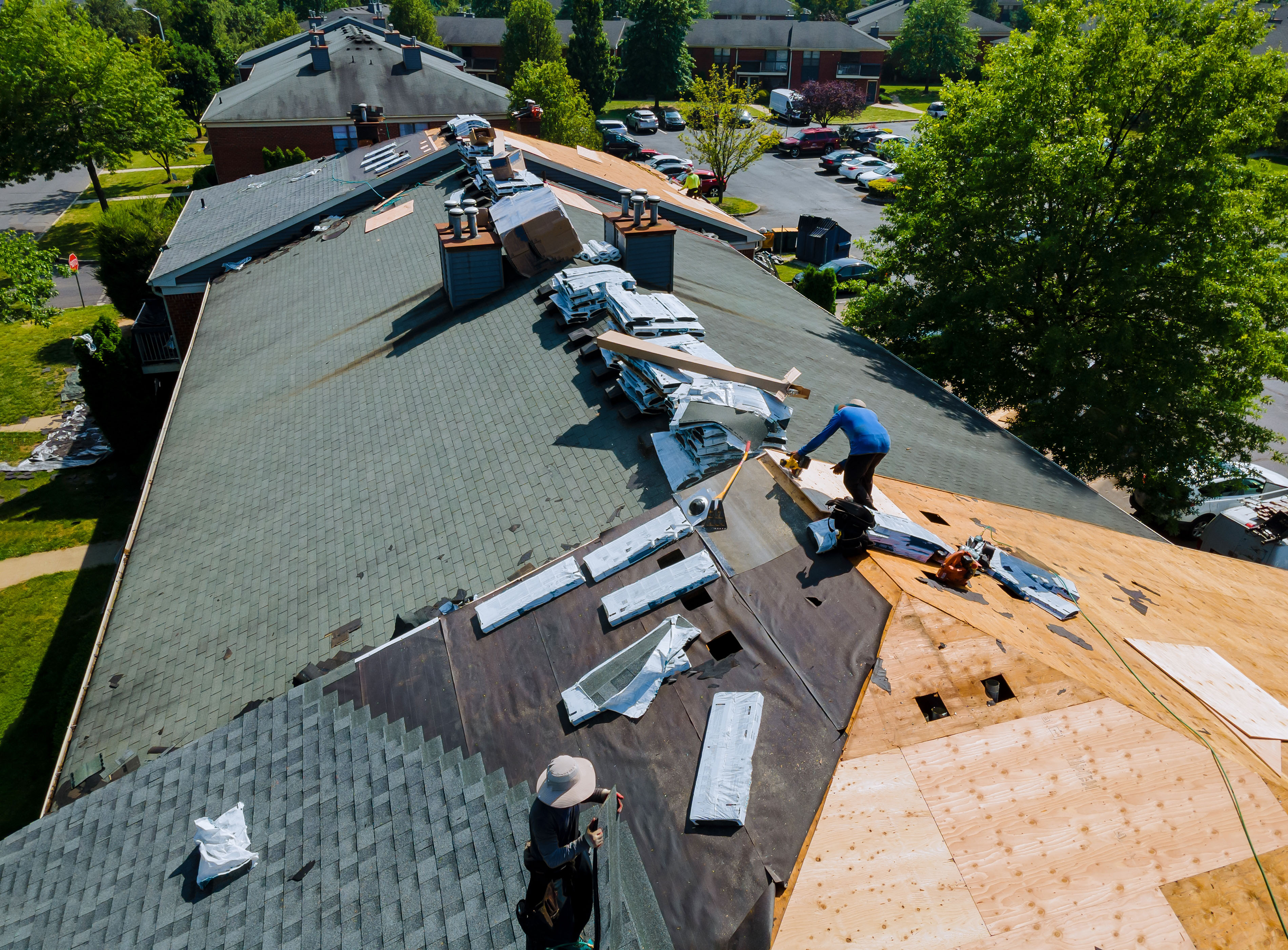 Crew renovating a residential roof